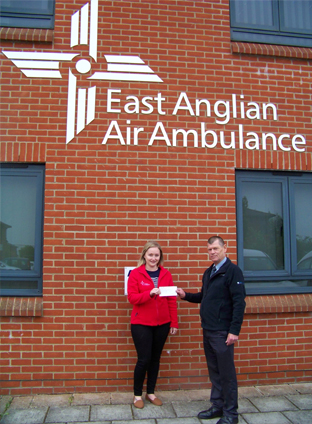 Great Yarmouth Base Manager, Malcolm Loades, handing over a cheque to Gemma Mckail at East Anglian Air Ambulance. Great Yarmouth Base Manager, Malcolm Loades, handing over a cheque to Gemma Mckail at East Anglian Air Ambulance.