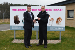Haydn Davies hands over cheque to Graeme Innes at the SSPCA re-homing centre in Drumoak. Haydn Davies hands over cheque to Graeme Innes at the SSPCA re-homing centre in Drumoak.